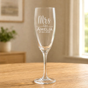 Clear glass Mrs champagne flute with frosted Amelia name and 21 Dec 2024 wedding date