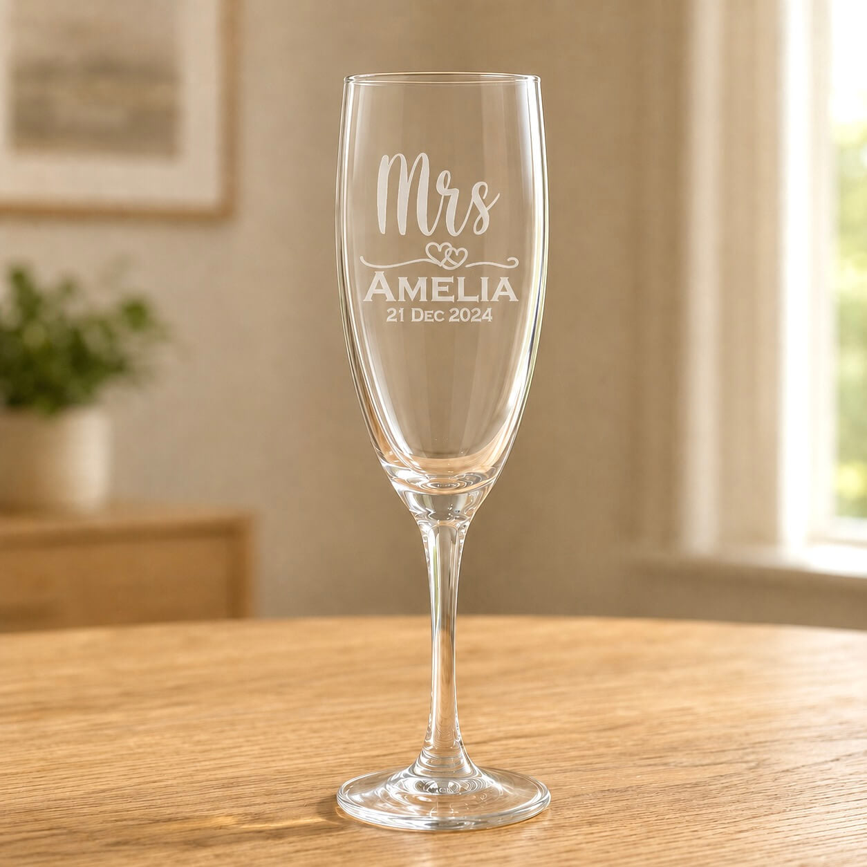 Clear glass Mrs champagne flute with frosted Amelia name and 21 Dec 2024 wedding date