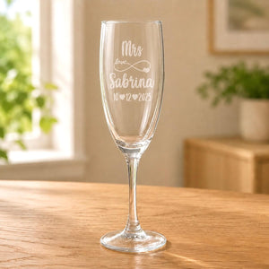 Clear glass Mrs champagne flute with frosted Sabrina name and 10 12 2025 wedding date