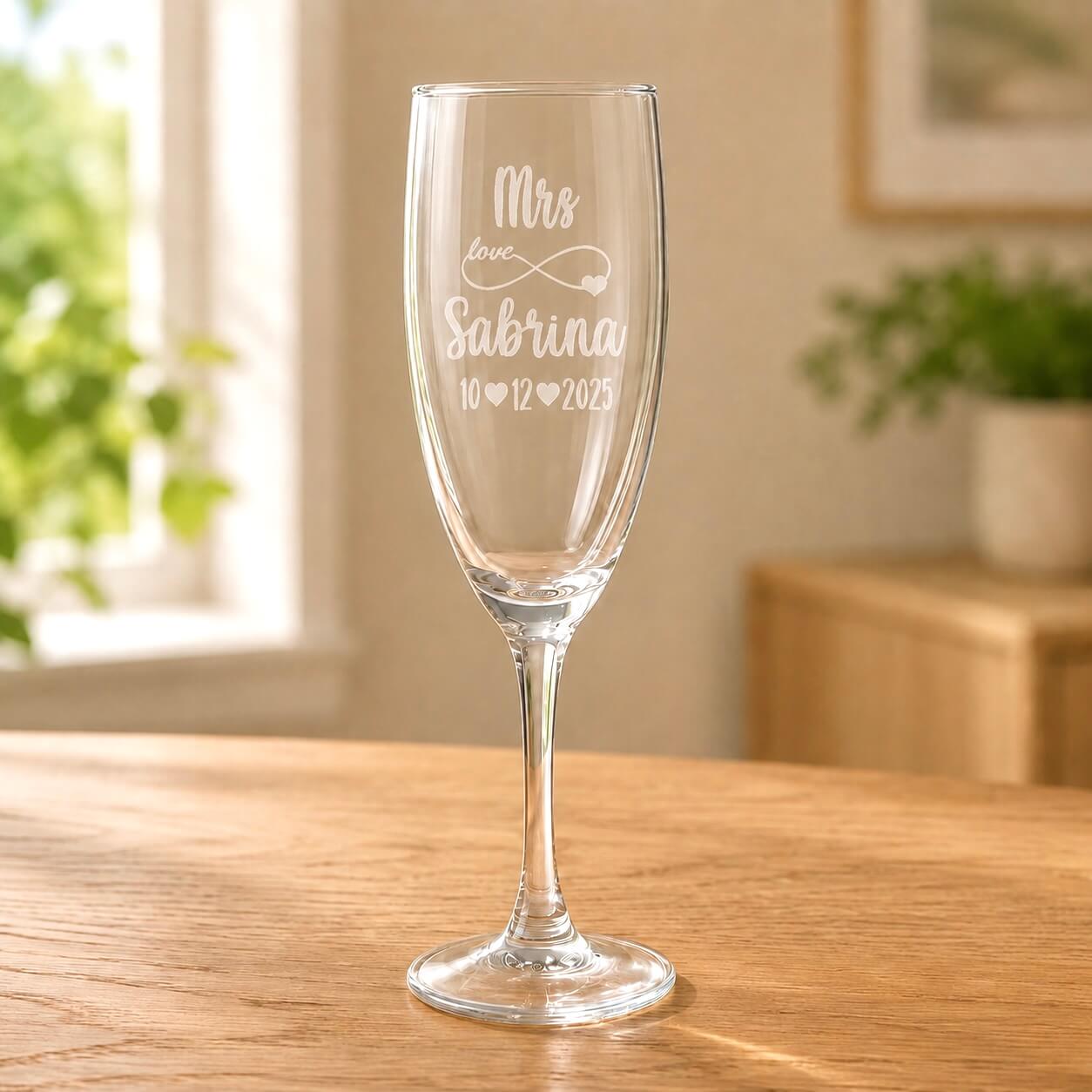 Clear glass Mrs champagne flute with frosted Sabrina name and 10 12 2025 wedding date