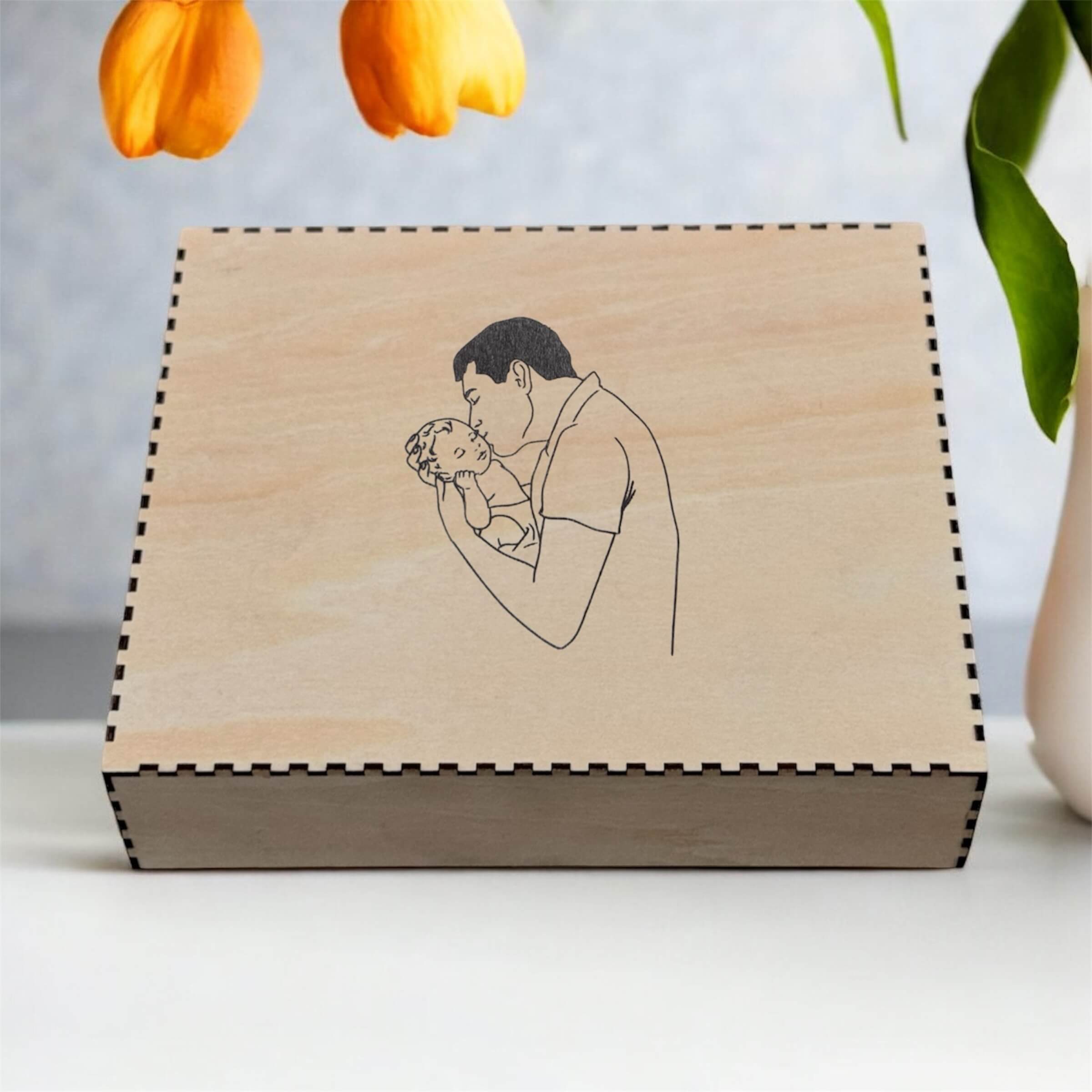 gift box with father kissing child image engraved