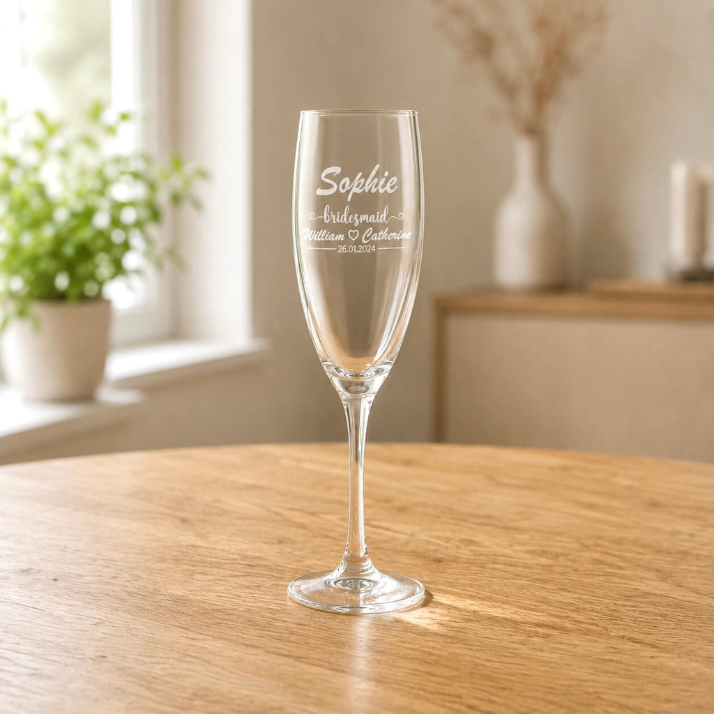 Personalised bridesmaid champagne flute engraved with name and couple wedding details