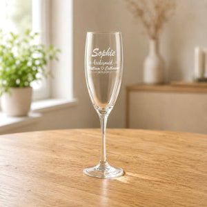 Personalised bridesmaid champagne flute engraved with name and couple wedding details