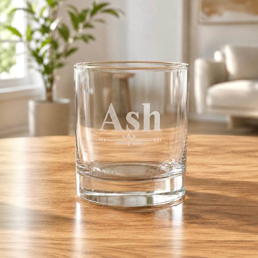 Close up of personalised whiskey tumbler glass engraved with name Ash