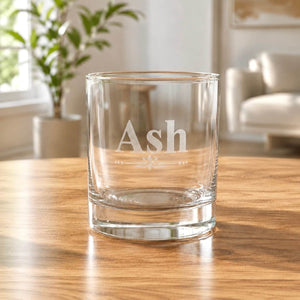Close up of personalised whiskey tumbler glass engraved with name Ash