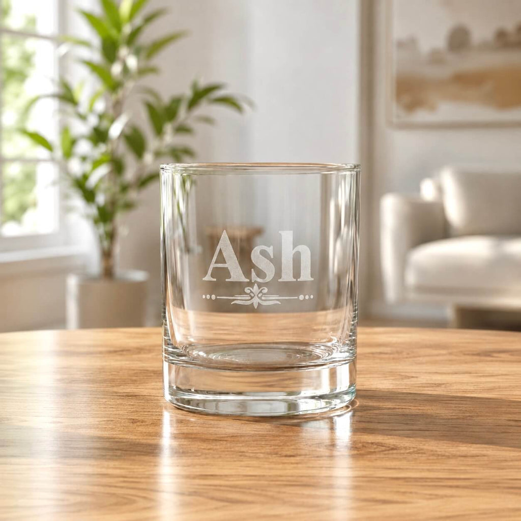 Custom name engraved whiskey glass with Ash design in bright home setting