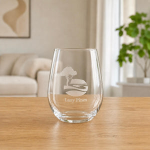 Personalised stemless wine glass with frosted business logo in bright home setting