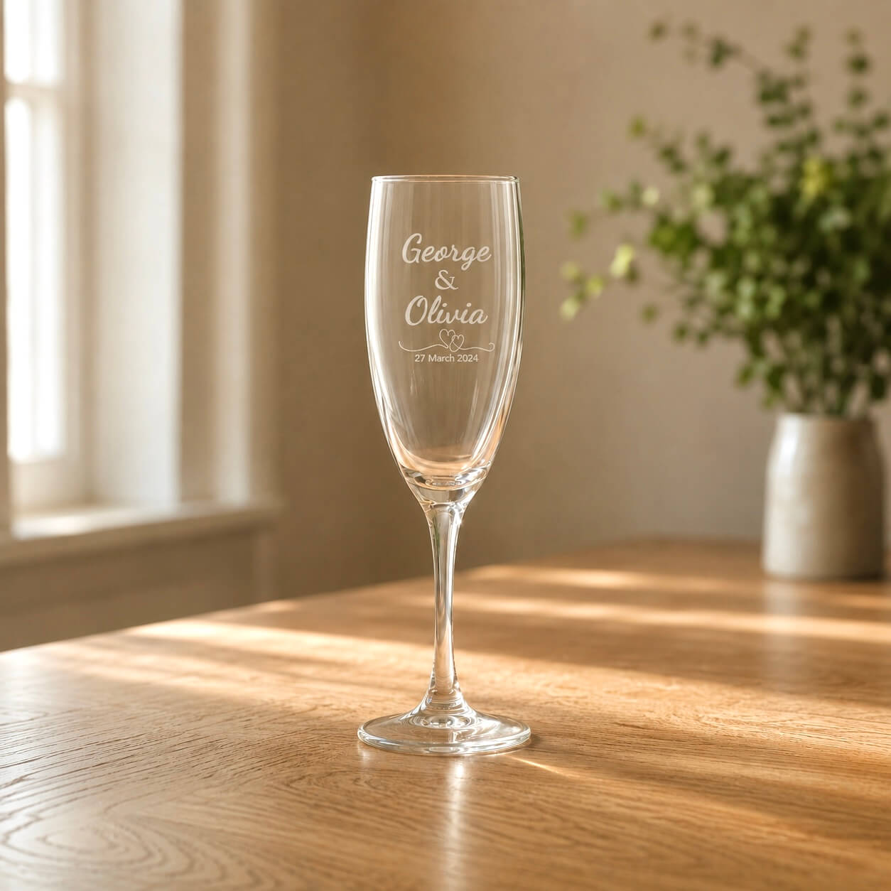 Personalised wedding champagne flute engraved with couple names and date