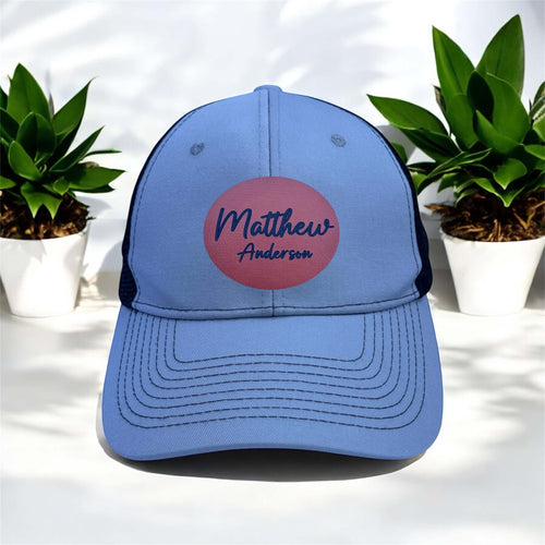 white and black cap with engraved patch